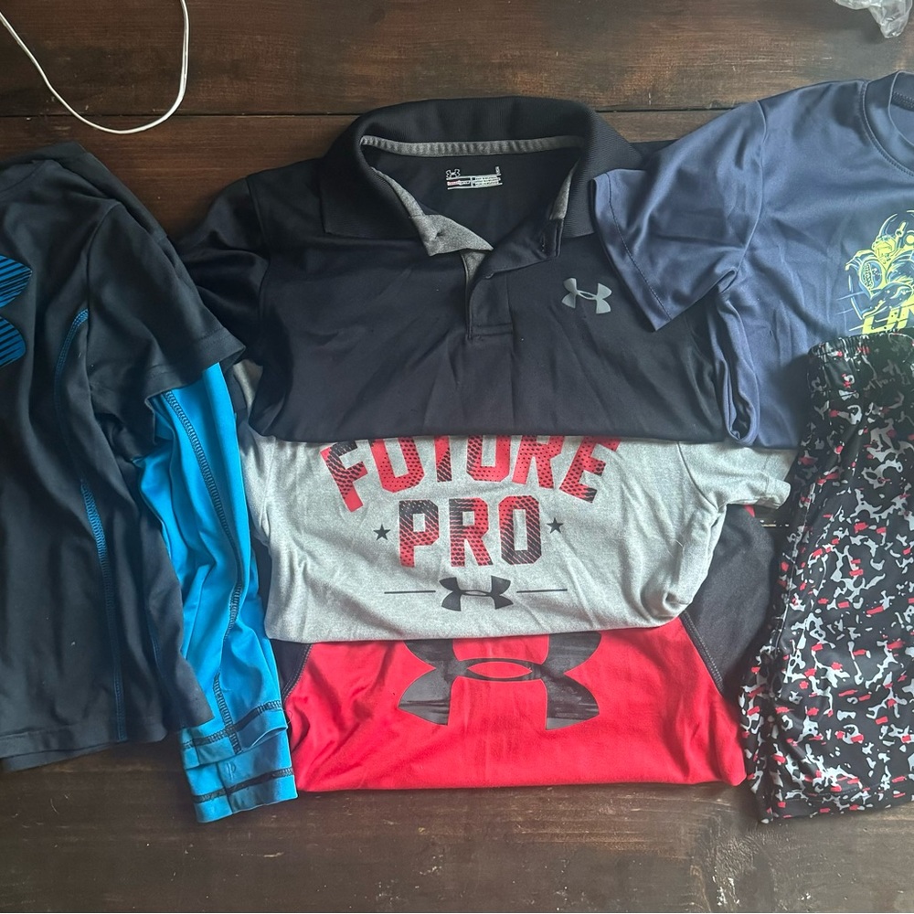 (4) UA short sleeve (1) UA longsleeve (1) UA shorts size youth 5 lot.
